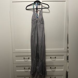 Great Maxi Dress. Has a ruffle slit on the side and ties behind the neck.
